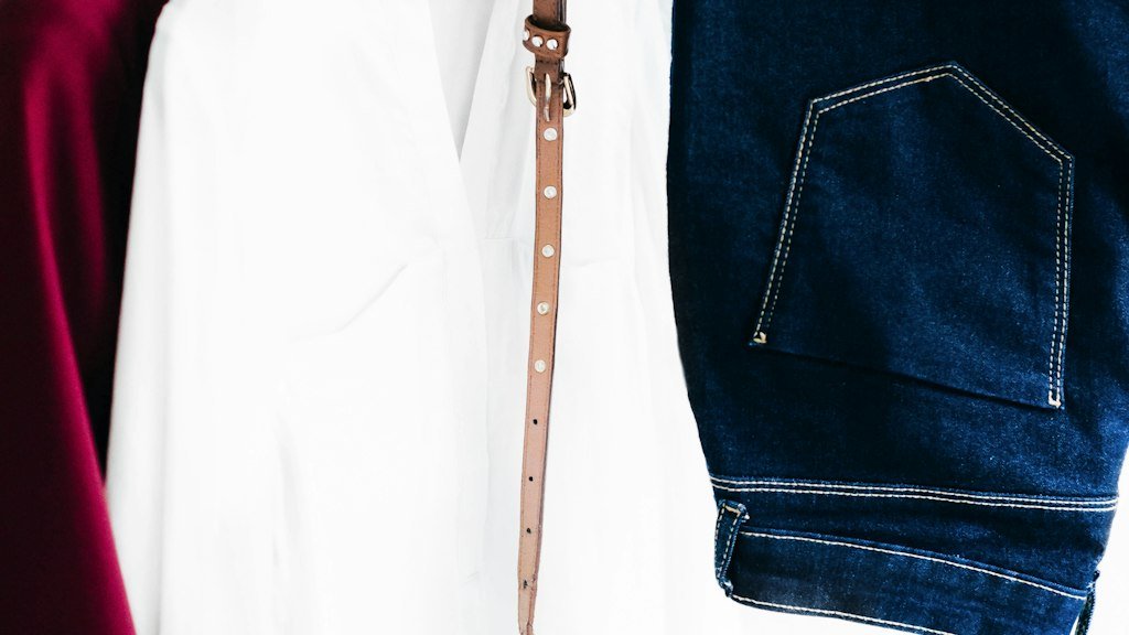 Neutral shirts styled with a belt and jeans