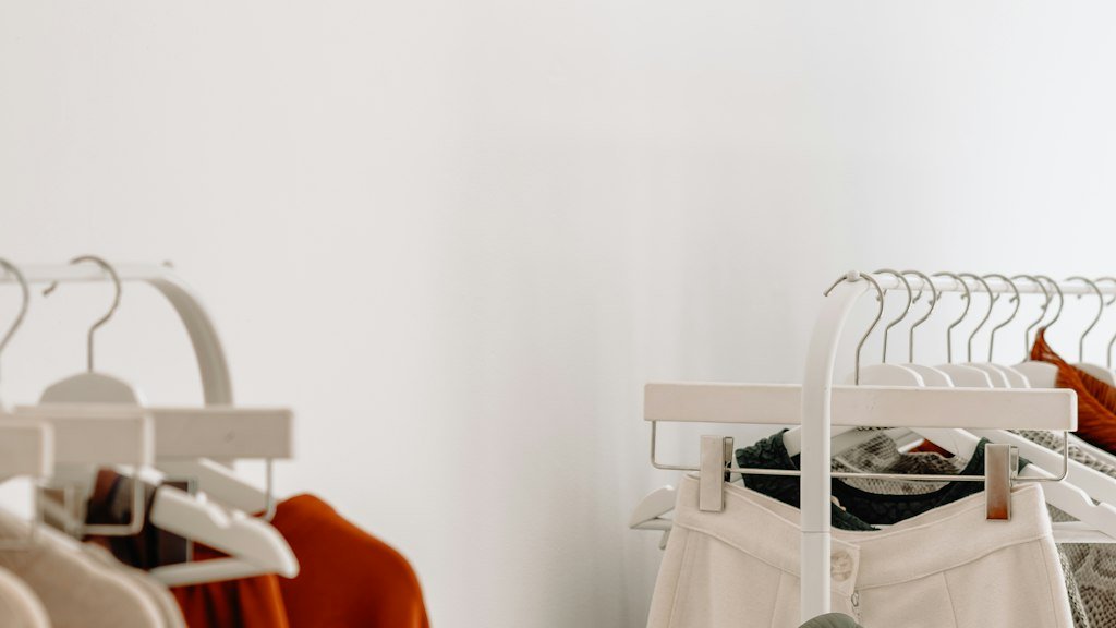 Clothing racks with neutral toned garments